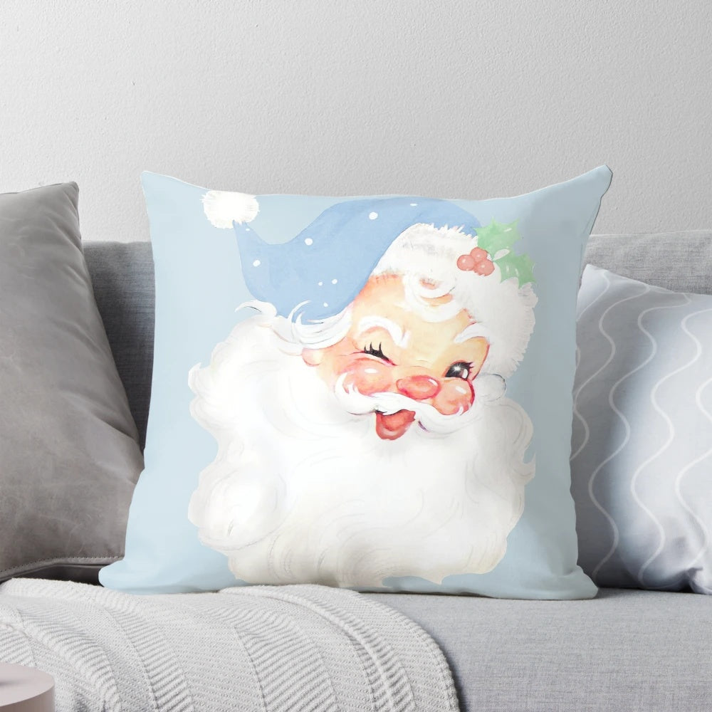 Vintage light blue Christmas pillow featuring a winking Santa Claus design