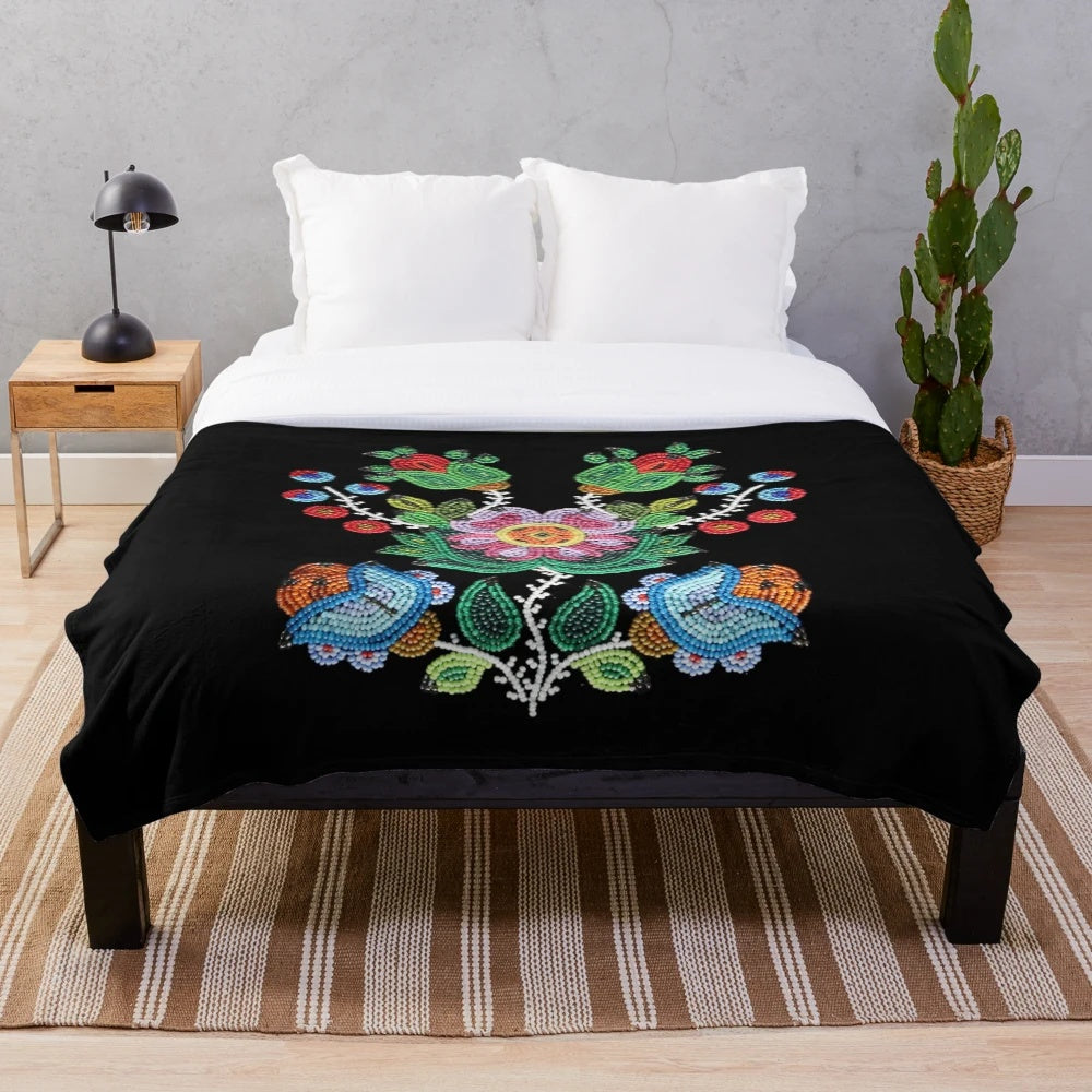 Vintage-style plush blanket with traditional Metis beadwork design