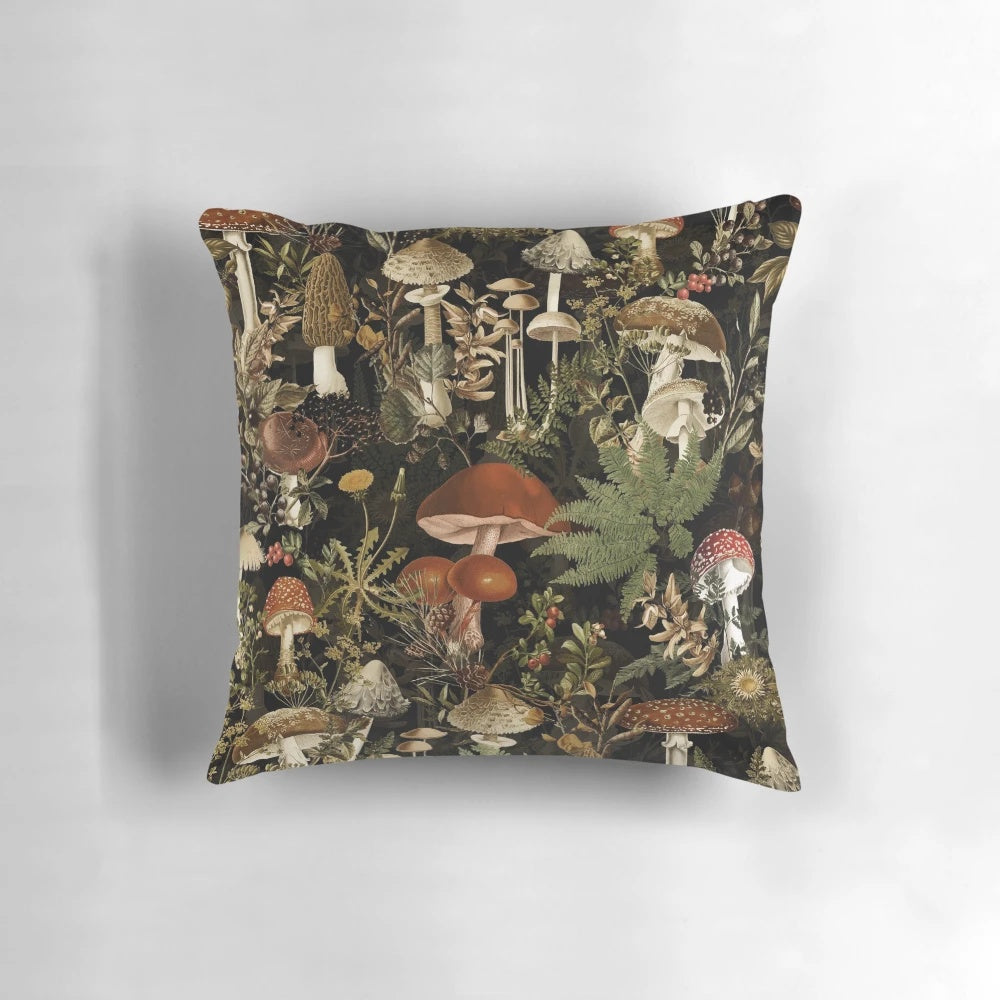 Vintage-style pillow with a dark, moody botanical pattern featuring mushrooms and a night garden scene