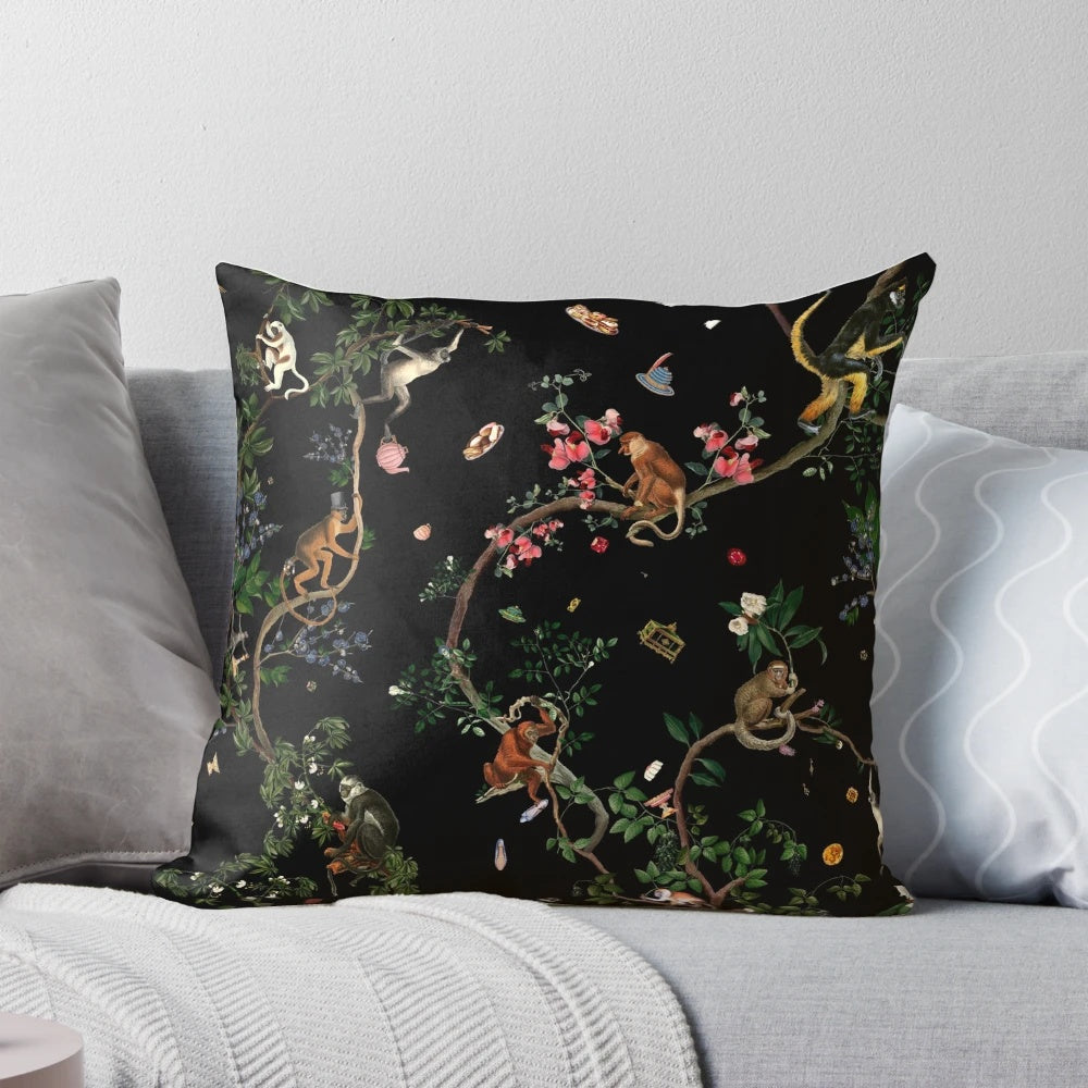 Vintage-inspired monkey pillow with tropical botanical illustrations