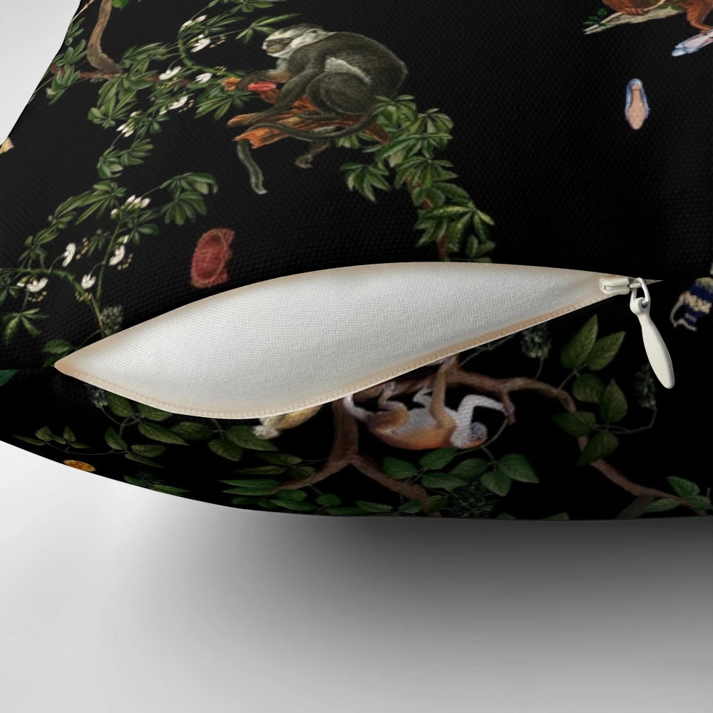Vintage-inspired monkey pillow with tropical botanical illustrations