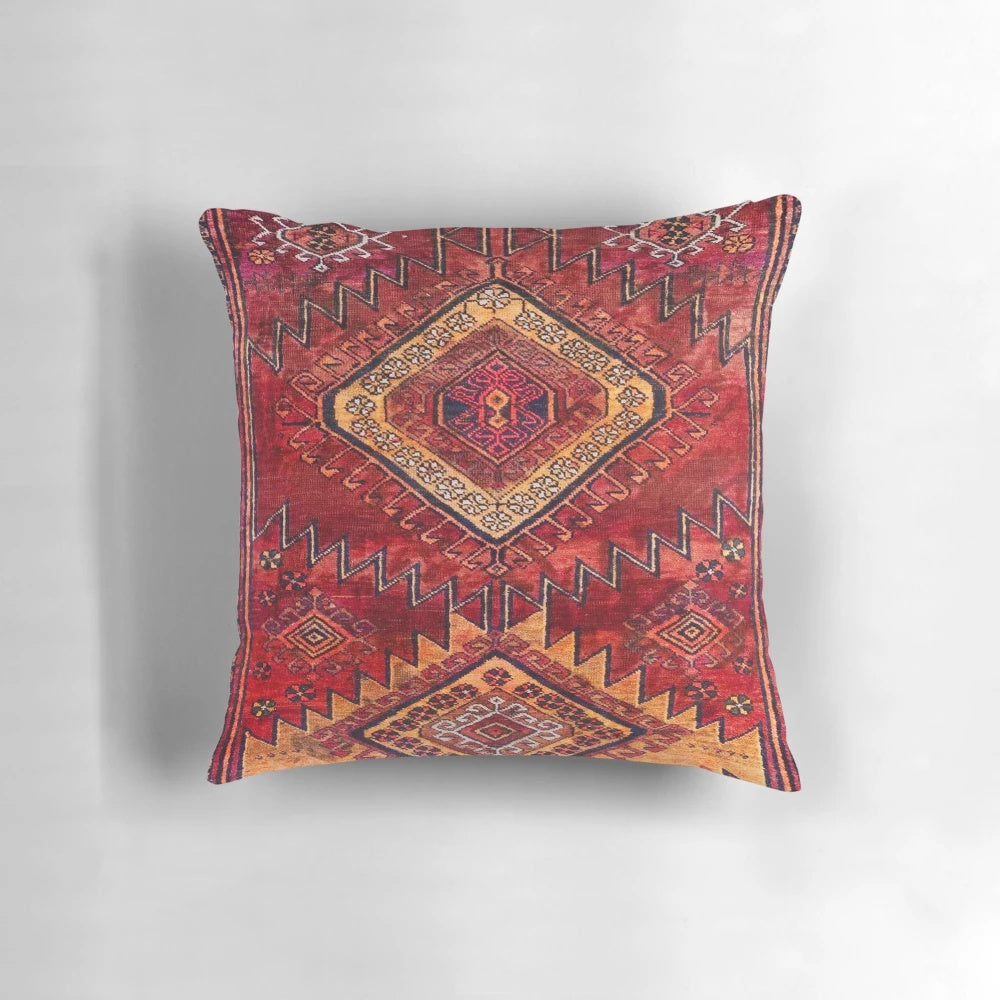 Vintage Moroccan style pillow with intricate damask pattern and earthy tones
