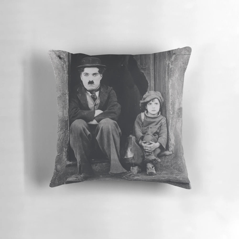 Vintage pillow featuring Charlie Chaplin and Jackie Coogan in the classic silent film "The Kid