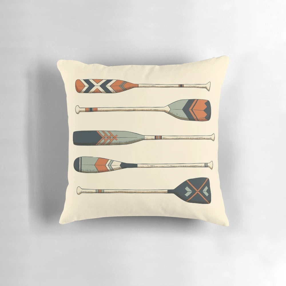 Vintage wooden oars printed on a decorative throw pillow for nautical home decor