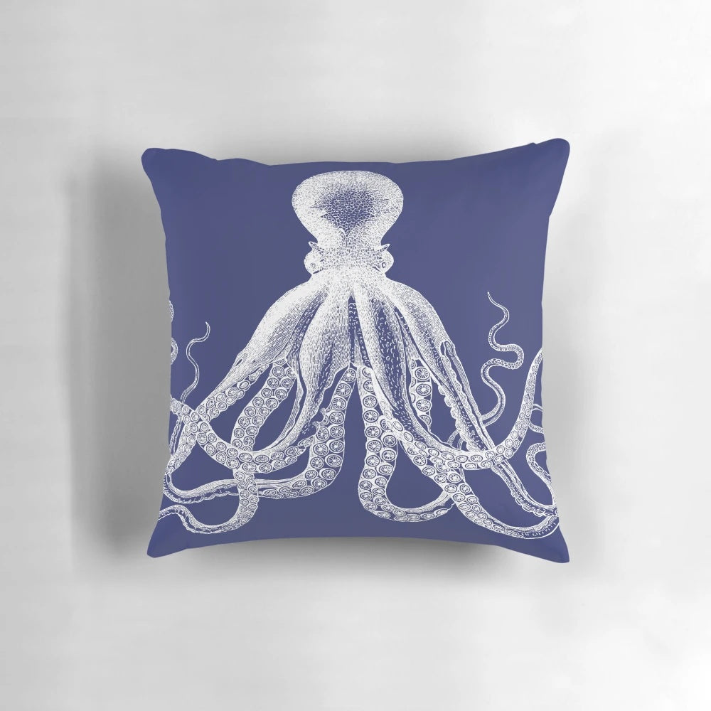 Vintage octopus illustration printed on a navy blue and white nautical-inspired pillow