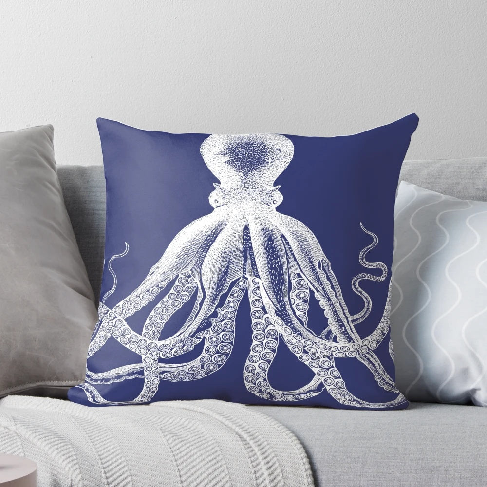 Vintage octopus illustration printed on a navy blue and white nautical-inspired pillow