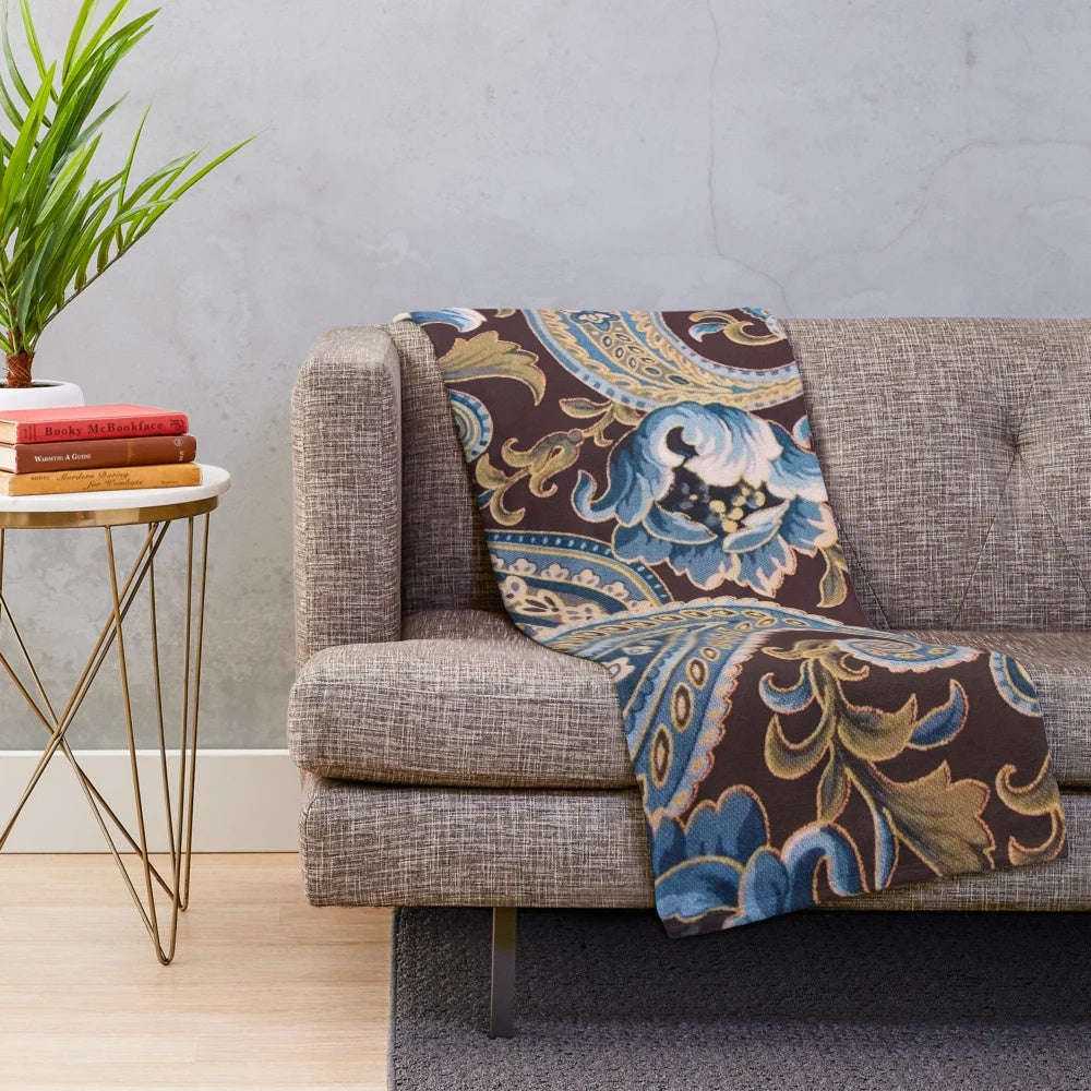 Vintage paisley pattern plush blanket in blue, brown, and beige tones