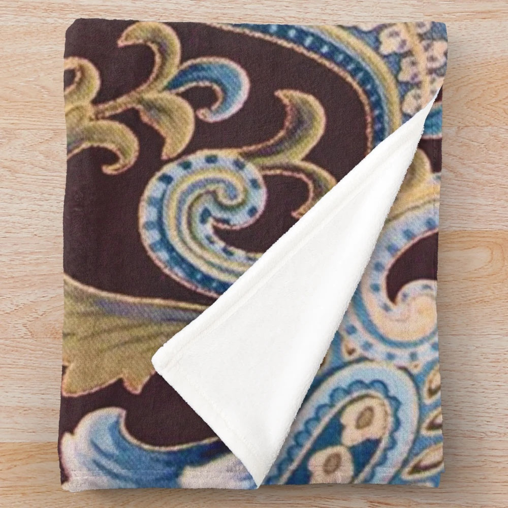 Vintage paisley pattern plush blanket in blue, brown, and beige tones