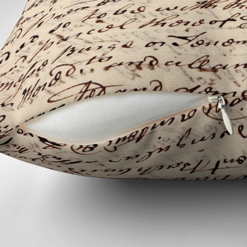 A vintage-style letter pillow with a handwritten calligraphy design, perfect for dark academia home decor.