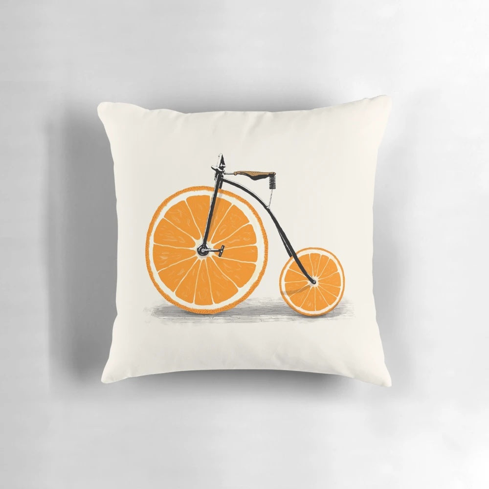 Vintage penny farthing bicycle with a juicy orange graphic on a plush pillow