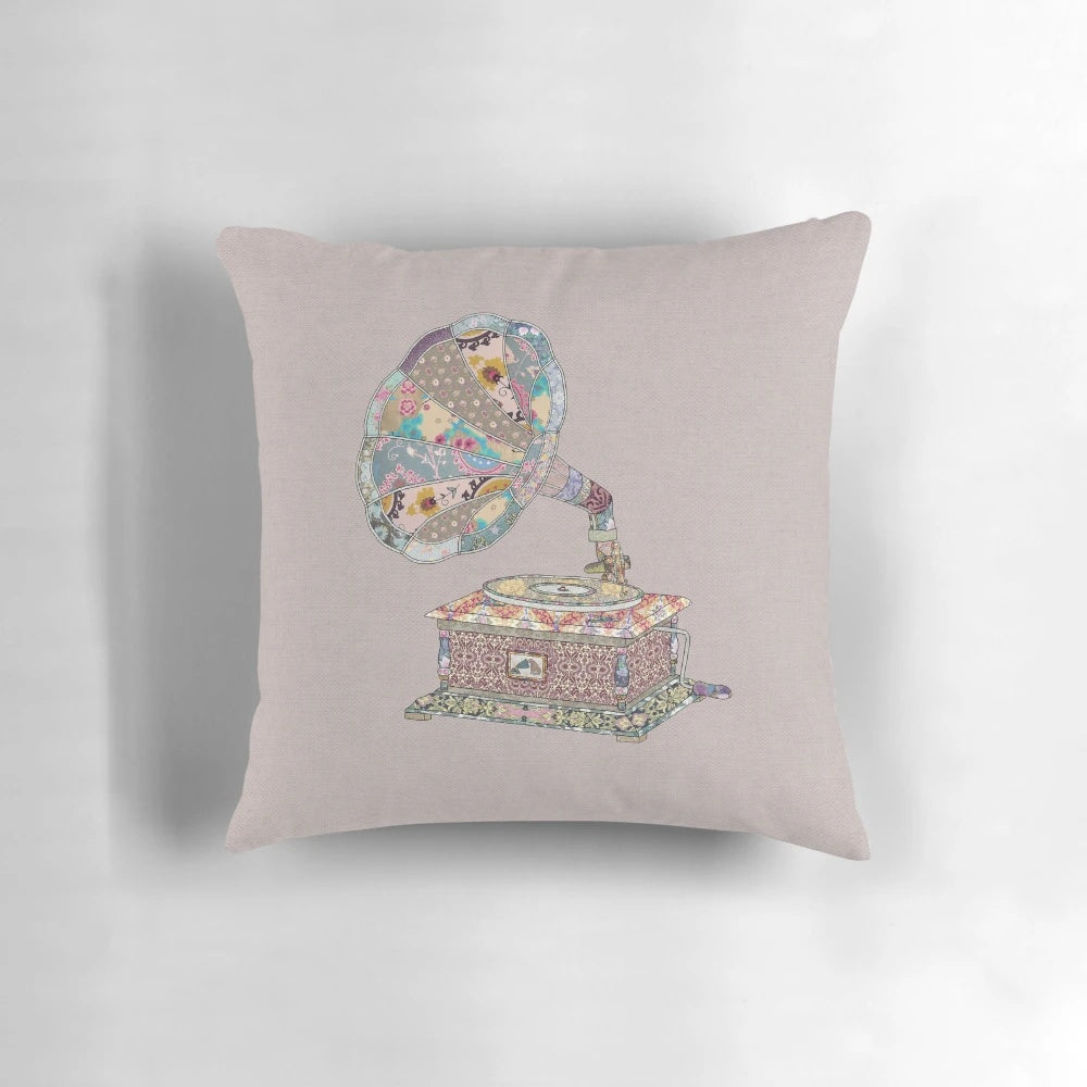 Vintage-inspired floral pattern pillow with a phonograph motif, perfect for music enthusiasts and home decor.