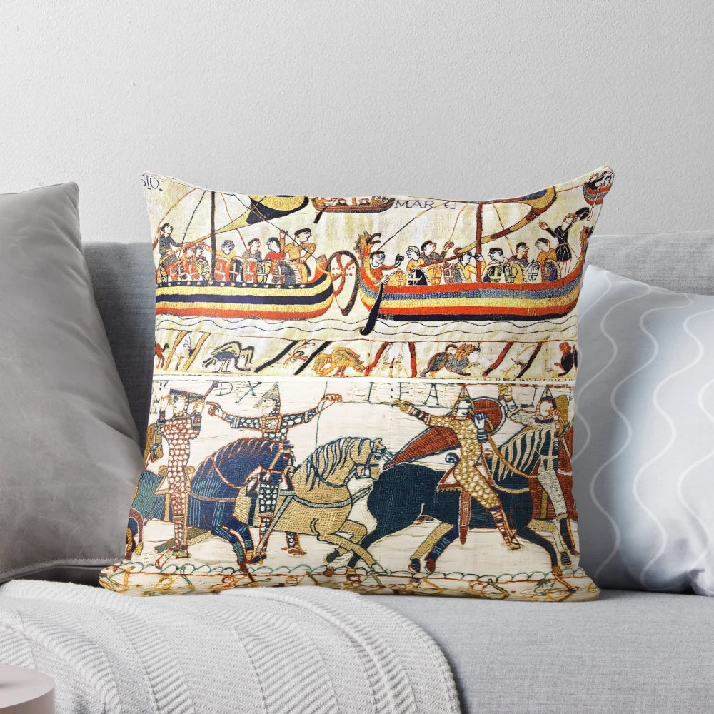 Vintage-style pillow depicting scenes from the Bayeux Tapestry, including medieval knights on horseback, archers, and Norman ships.