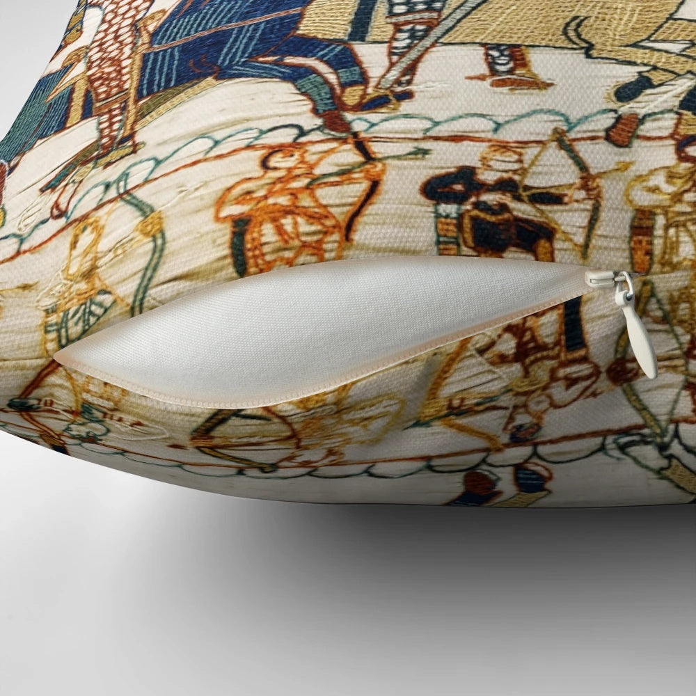Vintage-style pillow depicting scenes from the Bayeux Tapestry, including medieval knights on horseback, archers, and Norman ships.