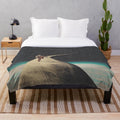 Vintage plush blanket featuring a surreal collage design of a lone wanderer on a cosmic journey