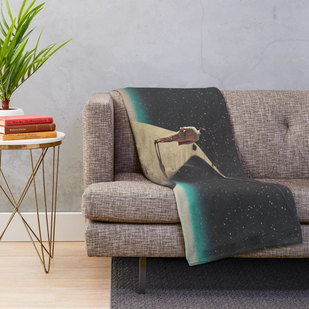 Vintage plush blanket featuring a surreal collage design of a lone wanderer on a cosmic journey