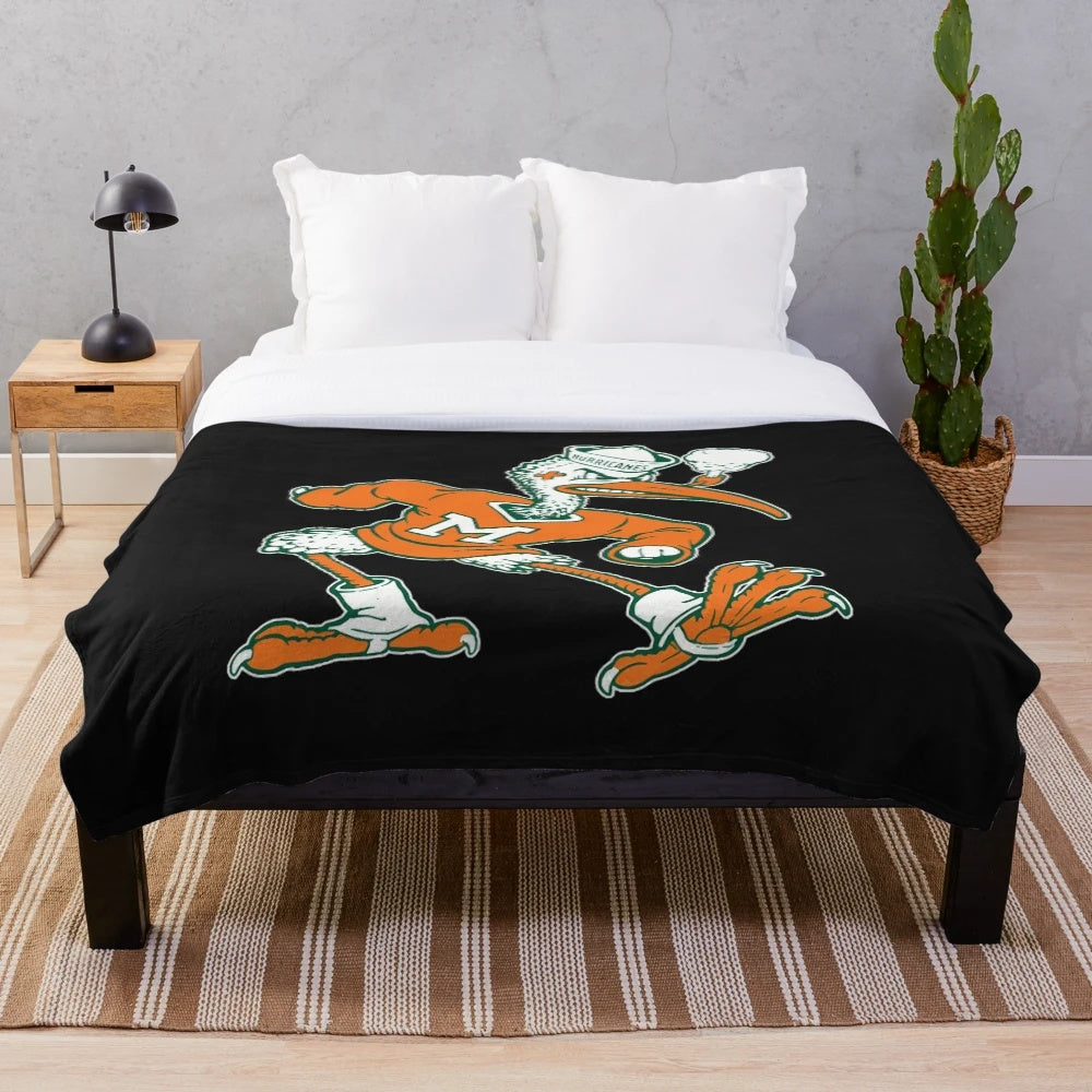 Vintage-style plush blanket featuring the Miami Hurricanes mascot 'Sebastian