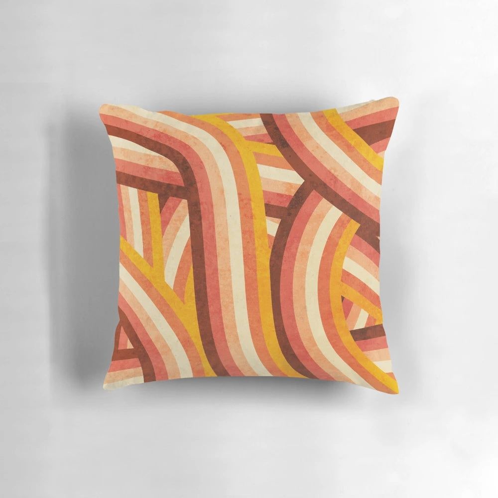 Vintage-style orange, brown, and cream striped pillow with a vibrant rainbow pattern