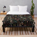 Vintage-style plush blanket with a botanical mushroom pattern in a retro floral night garden design