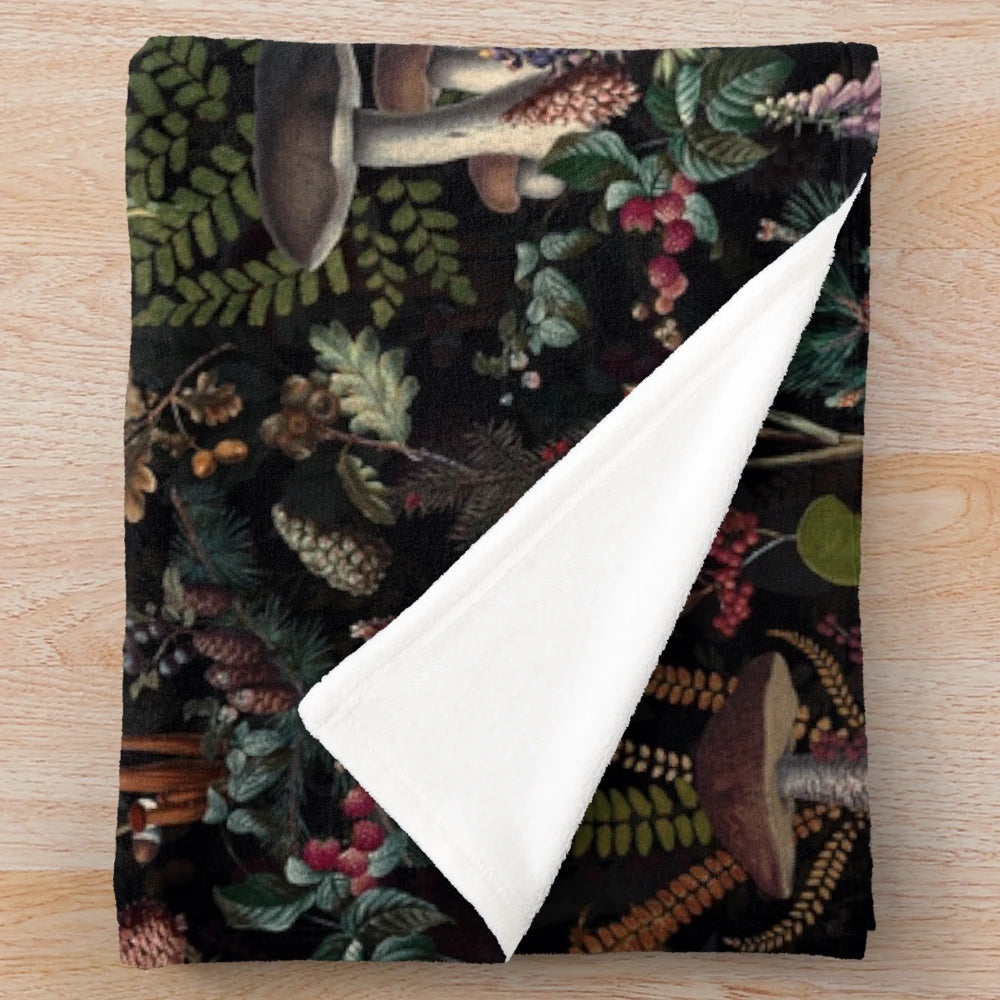 Vintage-style plush blanket with a botanical mushroom pattern in a retro floral night garden design