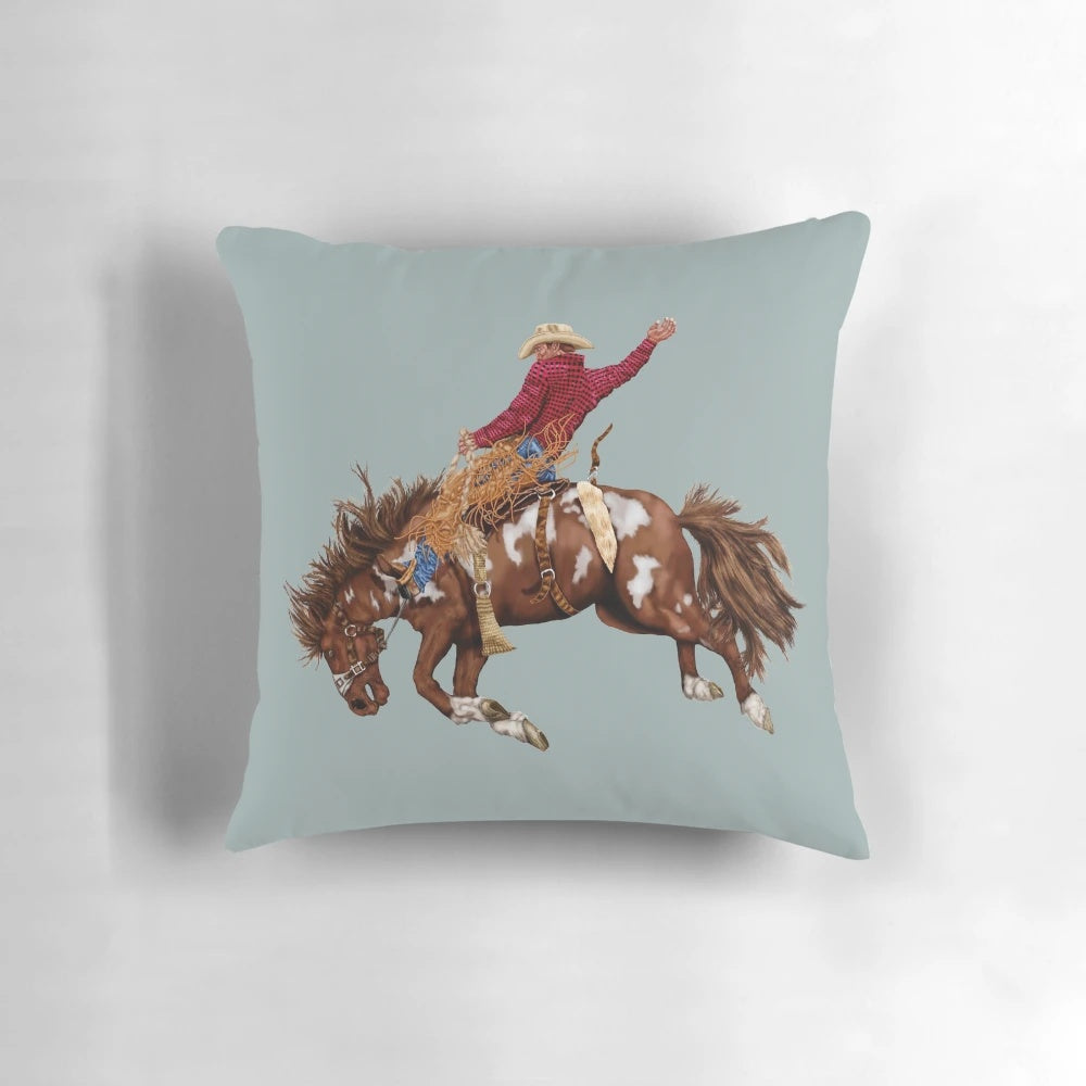 Vintage-style rodeo cowboy accent pillow with brown and white horse design
