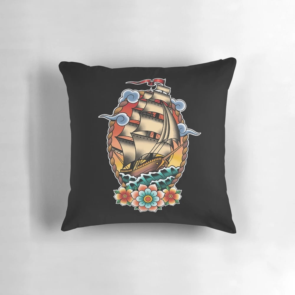 Vintage illustration of a traditional tattoo-style sailing ship or clipper ship on a decorative pillow for nautical home decor.