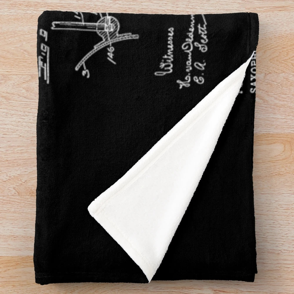 Vintage saxophone patent drawing print on a plush blanket