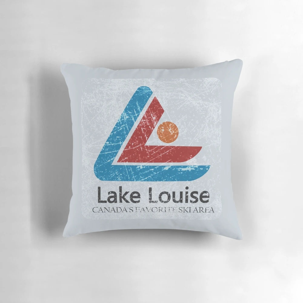 Vintage ski-themed decorative throw pillow with distressed mountain landscape of Lake Louise, Banff, Canada.