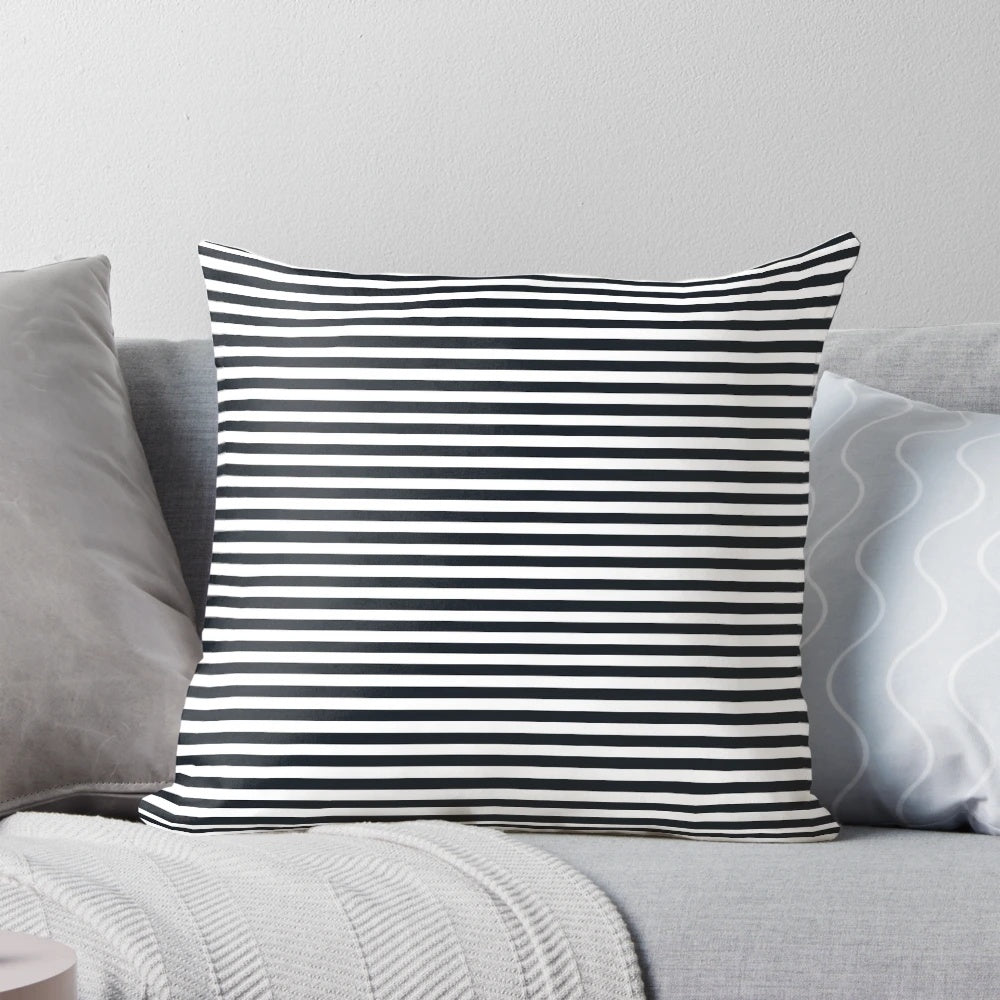 Vintage-inspired black and white striped pillow with a modern, elegant design.