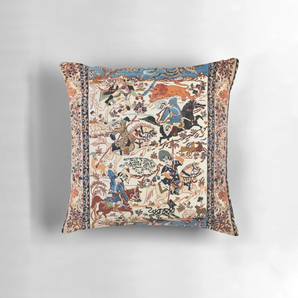 A decorative blue and white throw pillow featuring a vintage-inspired floral and animal print inspired by antique Persian rugs.