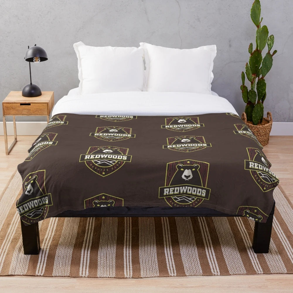 Vintage-style lacrosse plush blanket with team, sports, and cartoon design