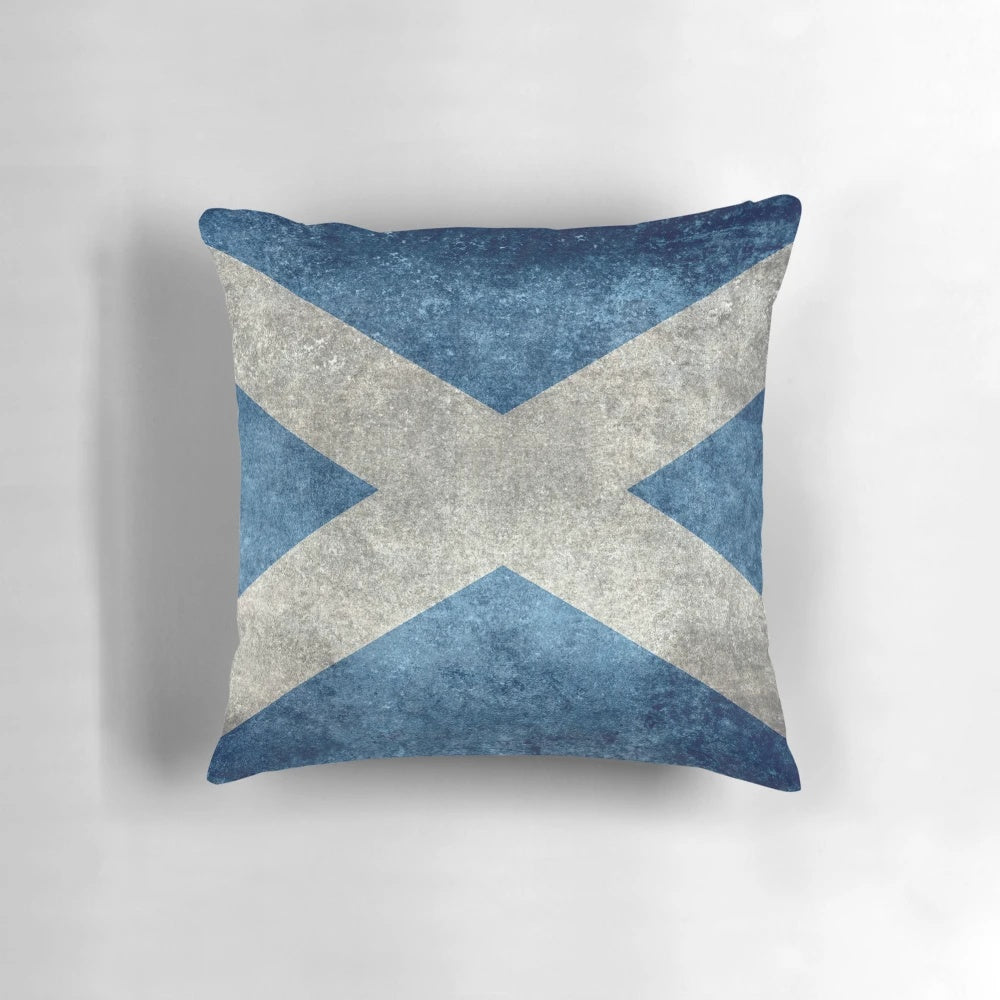 A vintage-style pillow featuring the Scottish flag, with a distressed, textured appearance.