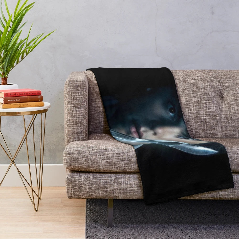 Vintage-style plush blanket featuring a character from the Scream movie franchise