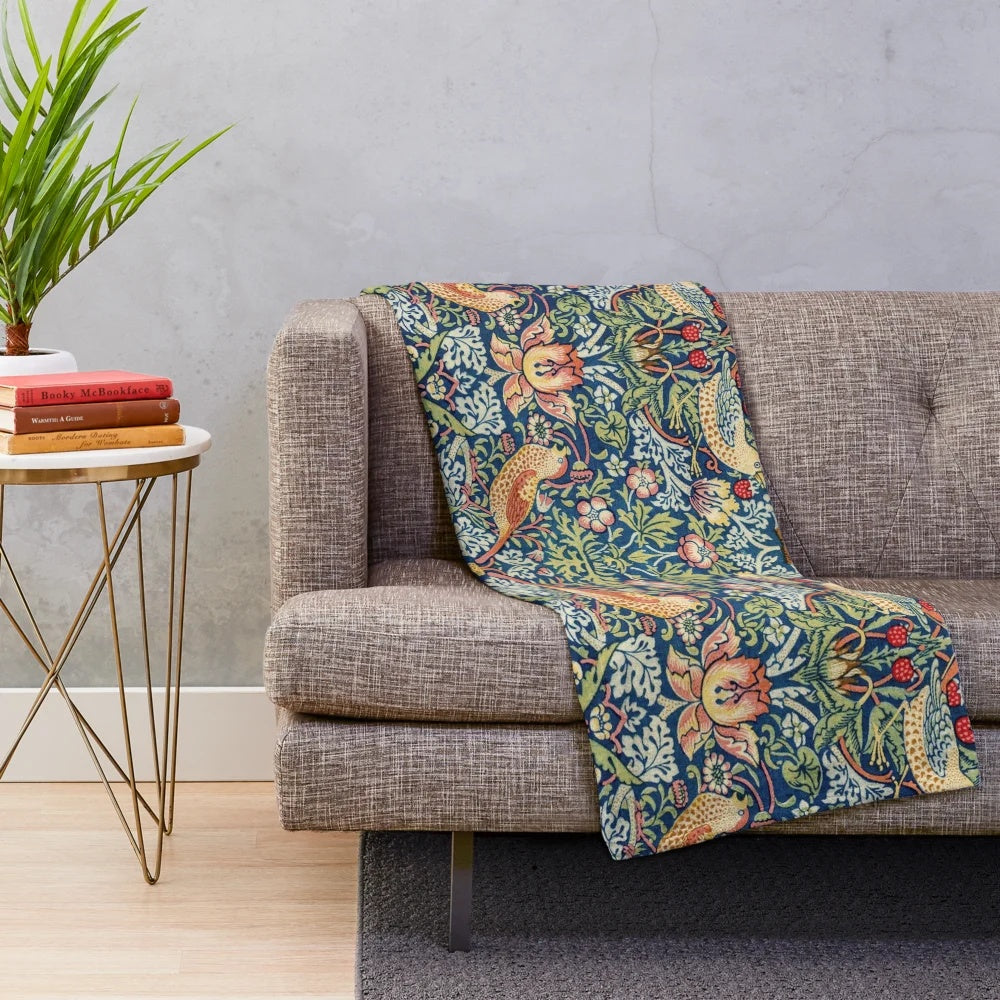 Plush blanket featuring the Strawberry Thief floral pattern by William Morris