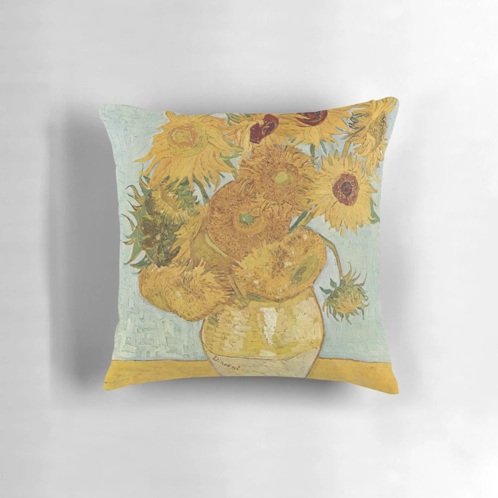 Vibrant yellow sunflowers in the style of the classic Van Gogh painting on a decorative throw pillow.