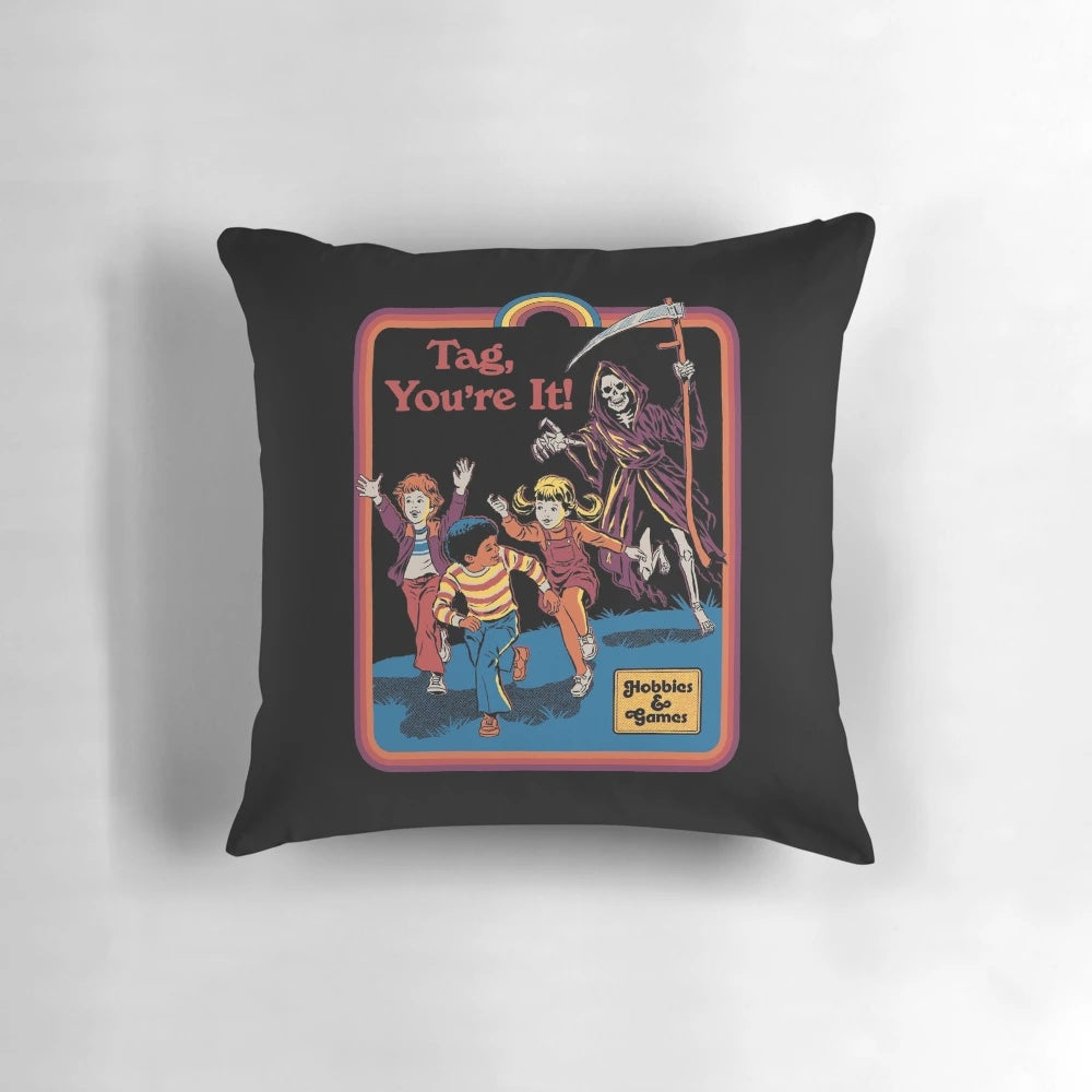 Vintage-style pillow featuring a playful grim reaper chasing a person with the text "Tag, You're It