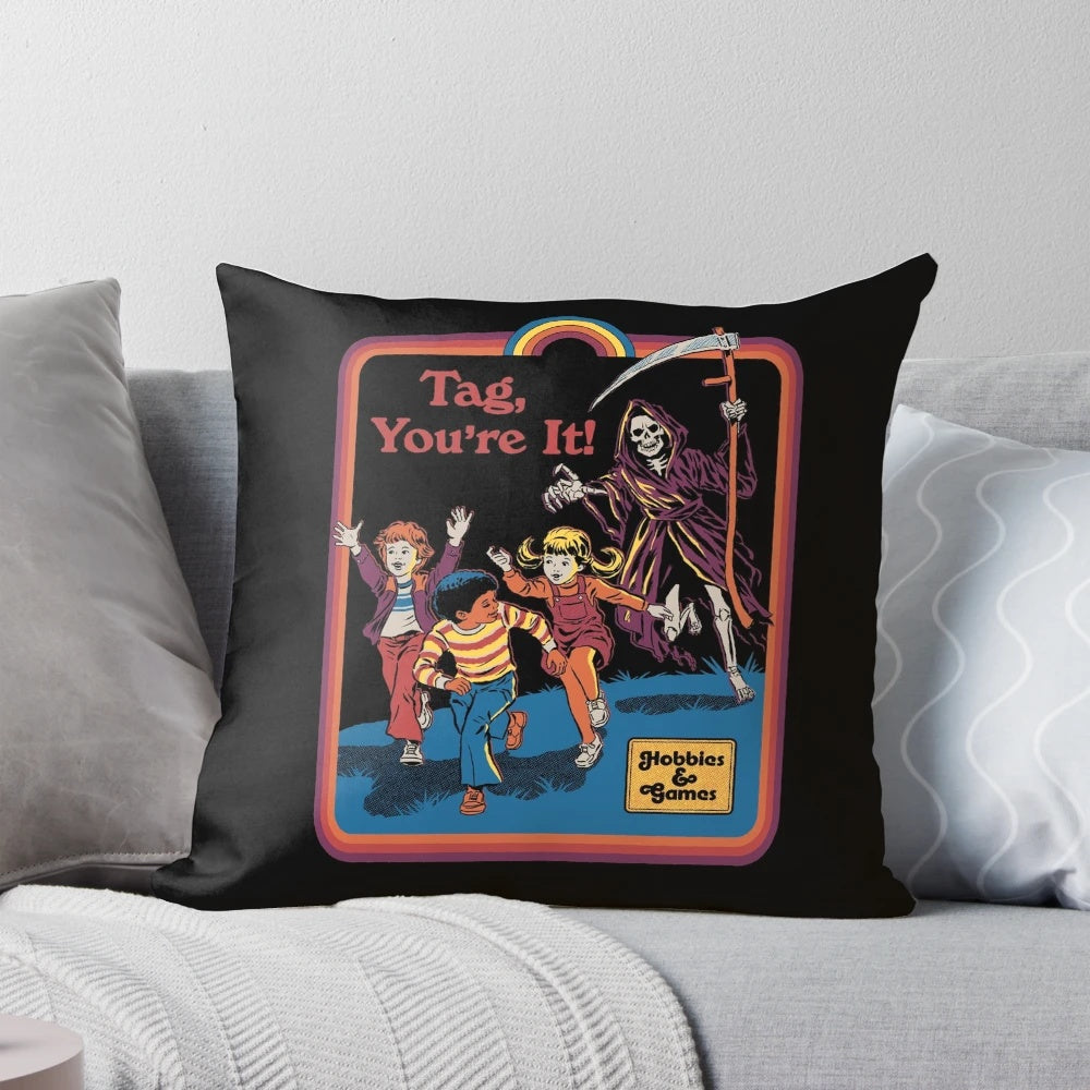 Vintage-style pillow featuring a playful grim reaper chasing a person with the text "Tag, You're It