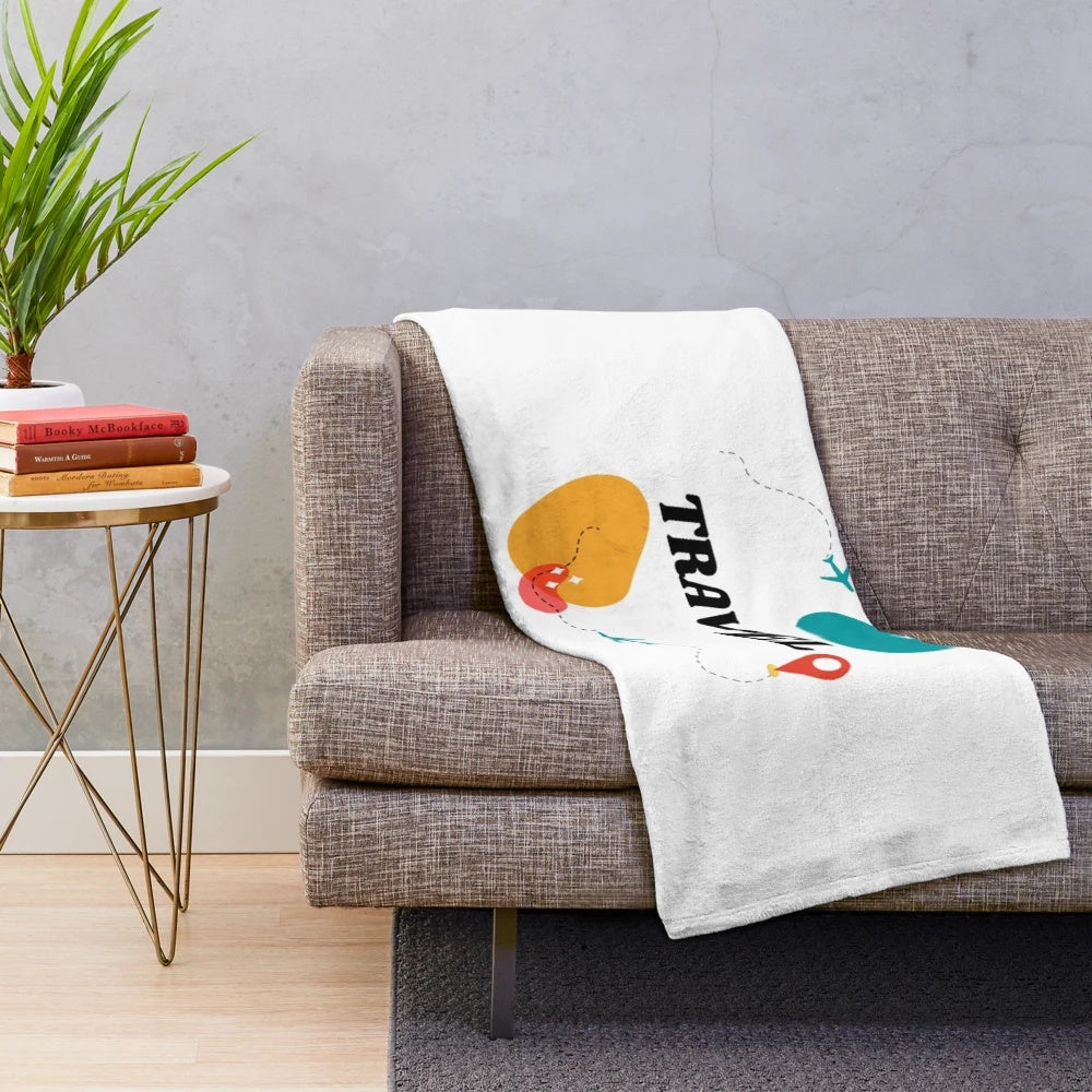 Vintage travel inspired plush blanket featuring an airplane design