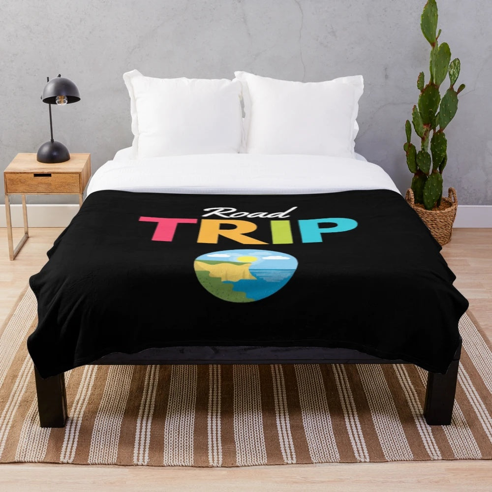 Vintage travel-inspired plush blanket with mountain and forest design