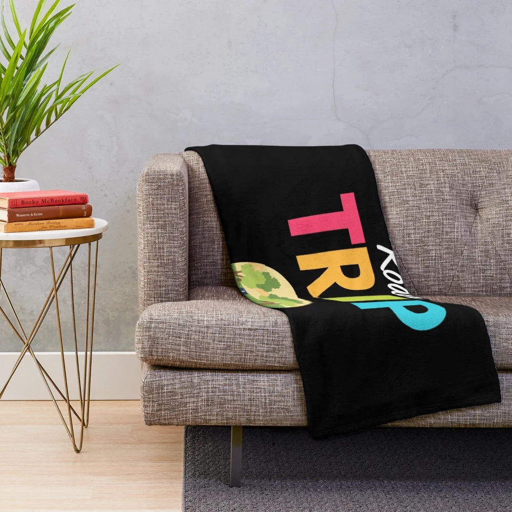 Vintage travel-inspired plush blanket featuring a scenic mountain and forest landscape