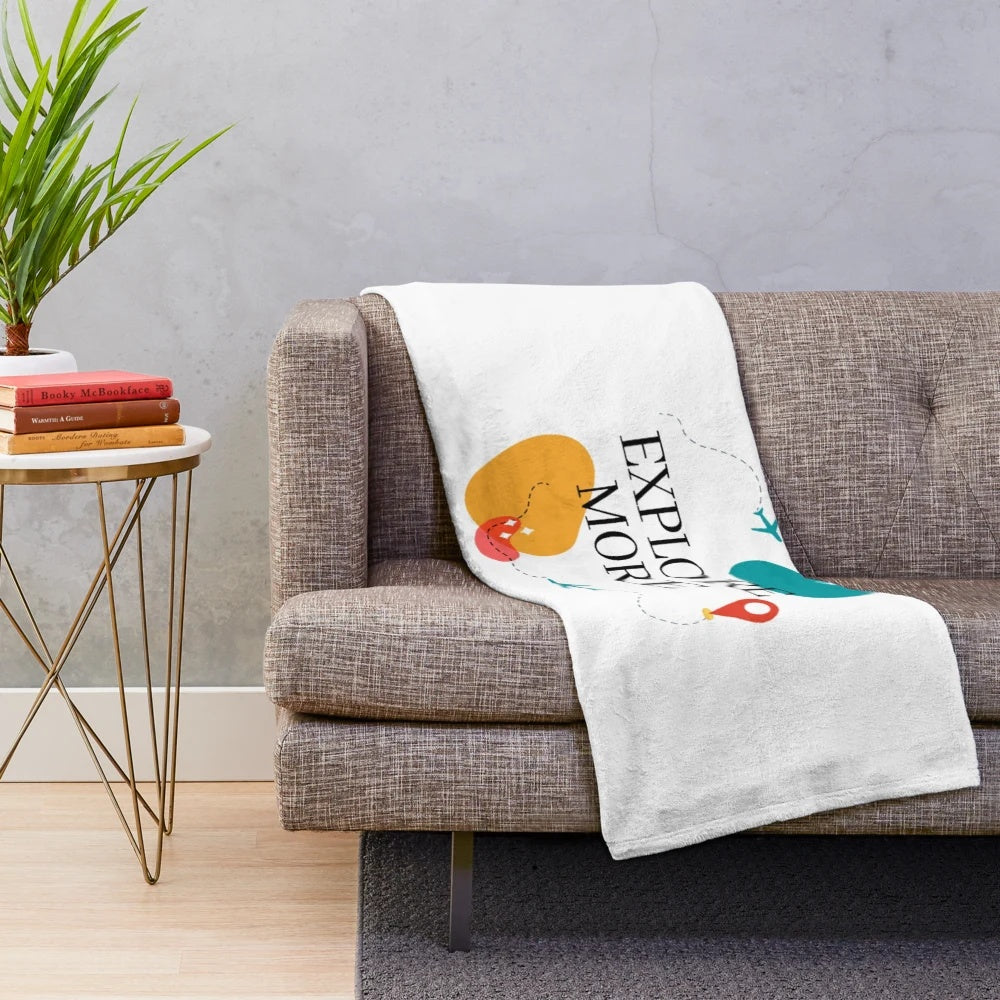 Vintage travel-inspired plush blanket featuring an airplane and retro design