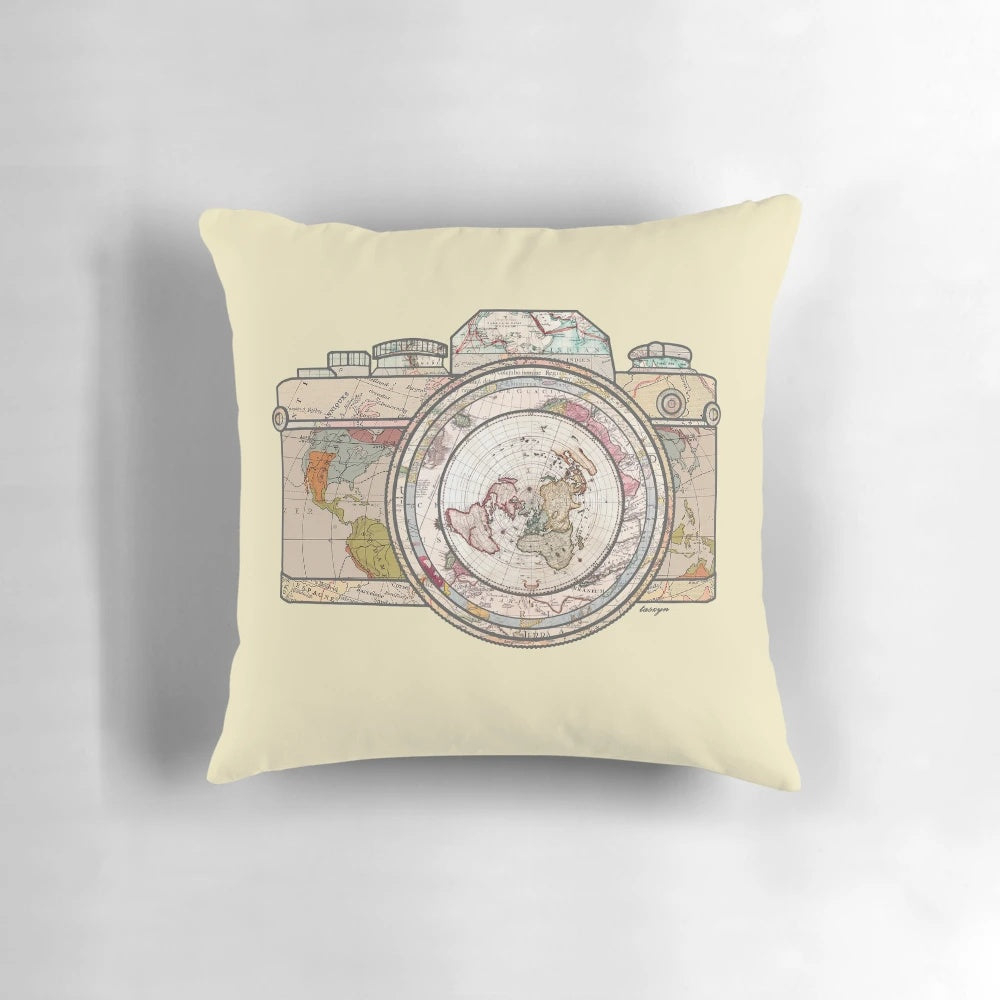 Vintage-inspired travel pillow with floral pattern and world map graphics