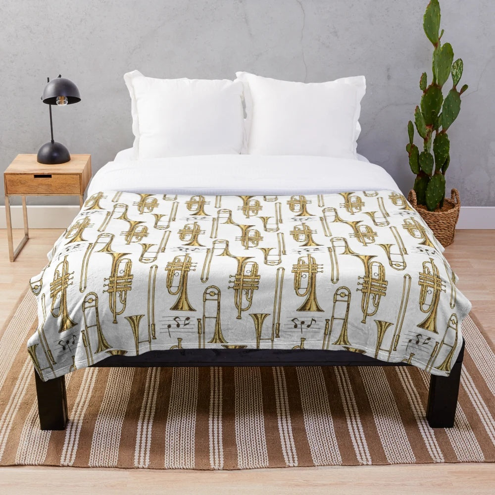 Cozy plush blanket featuring a vintage-style trumpet design for music enthusiasts