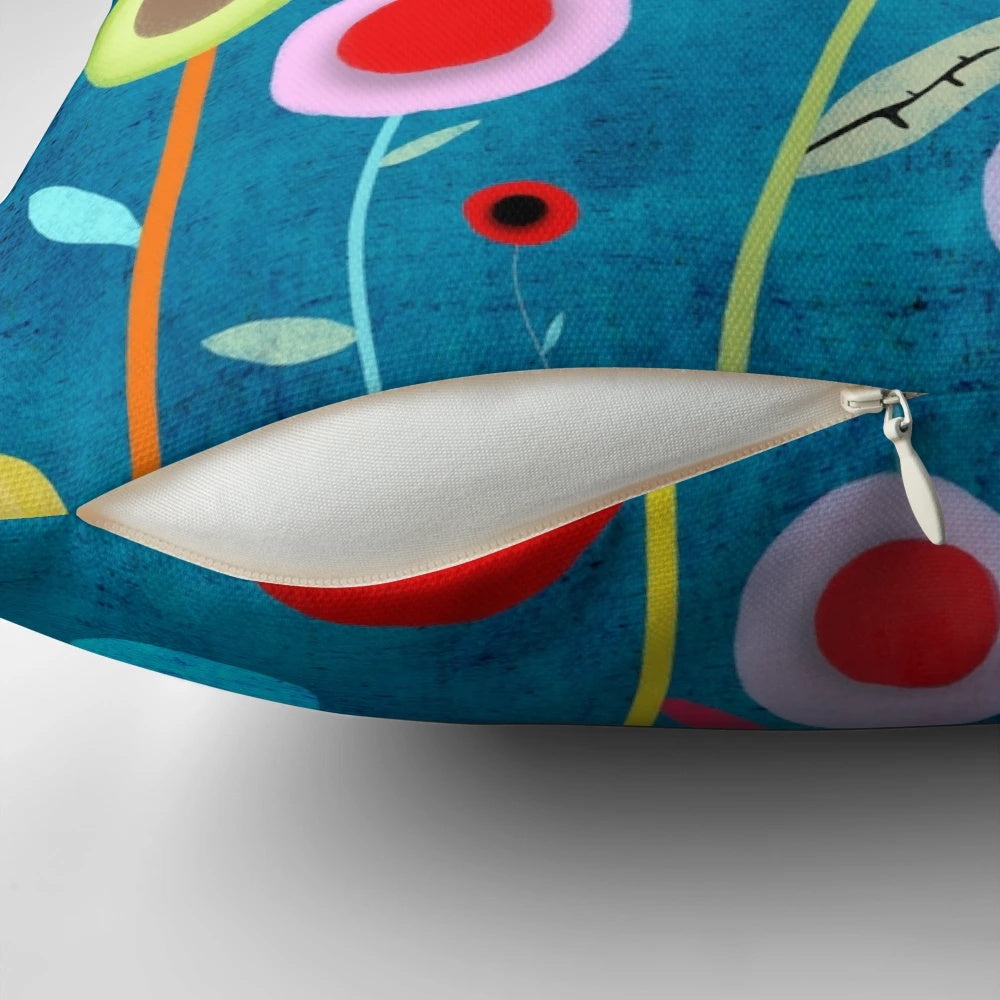 Vintage-inspired turquoise polka dot pillow with distressed blue floral pattern