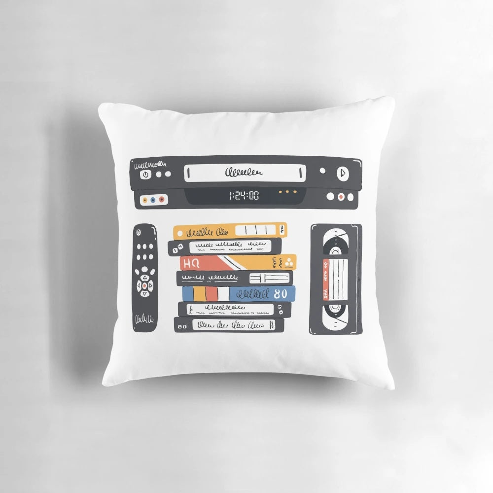 Vintage VHS videocassette tape player pillow with retro technology design