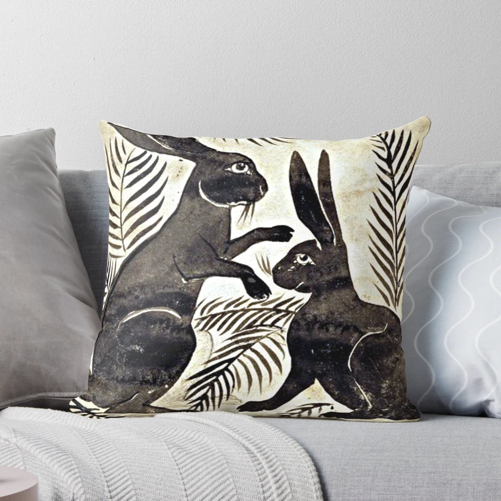 Vintage-style decorative throw pillow featuring a pattern of whimsical hares, inspired by the designs of William de Morgan.