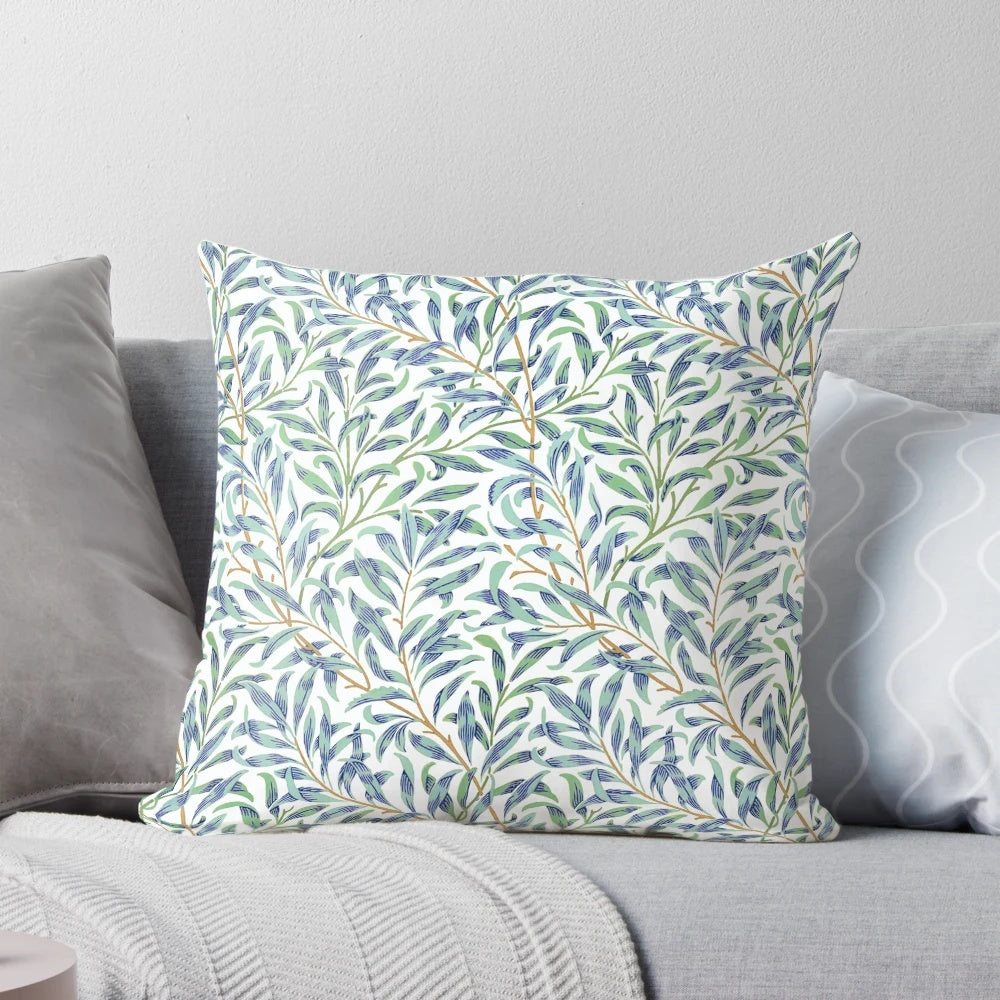 Vintage-inspired William Morris pillow featuring a beautiful botanical leaf pattern in shades of blue and green on an off-white background.