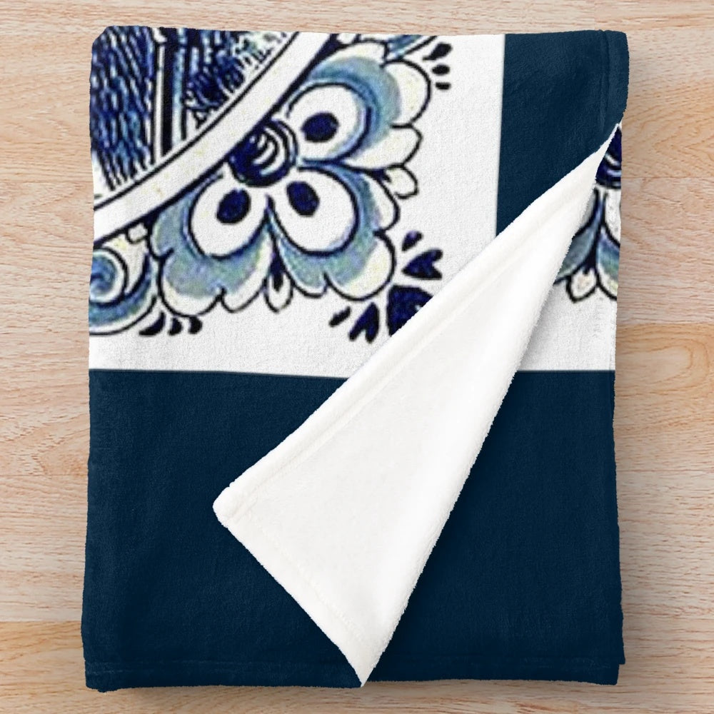 Vintage windmill print plush blanket featuring a whimsical Dutch Blue Delft style design