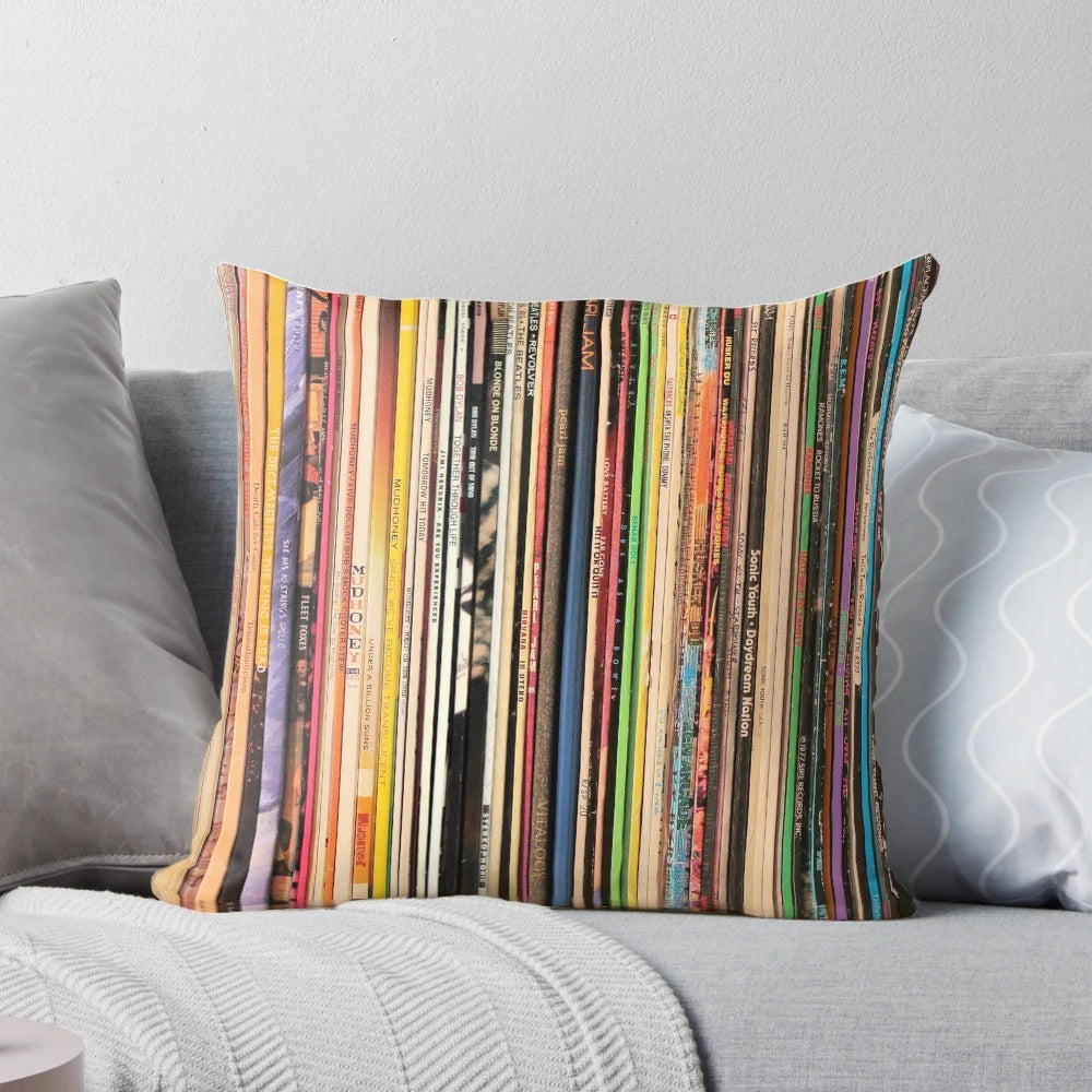 A cozy, stylish pillow featuring a design of vintage vinyl records, perfect for record collectors and music enthusiasts.