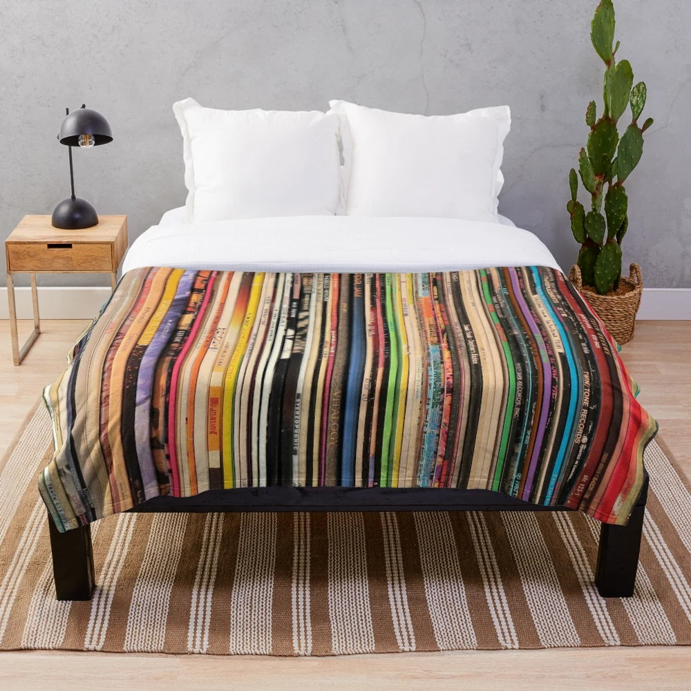 Cozy plush blanket featuring a vintage record player and vinyl records design