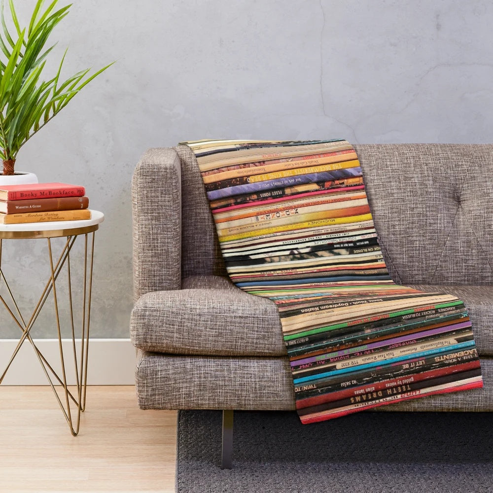 Cozy plush blanket featuring a vintage record player and vinyl records design